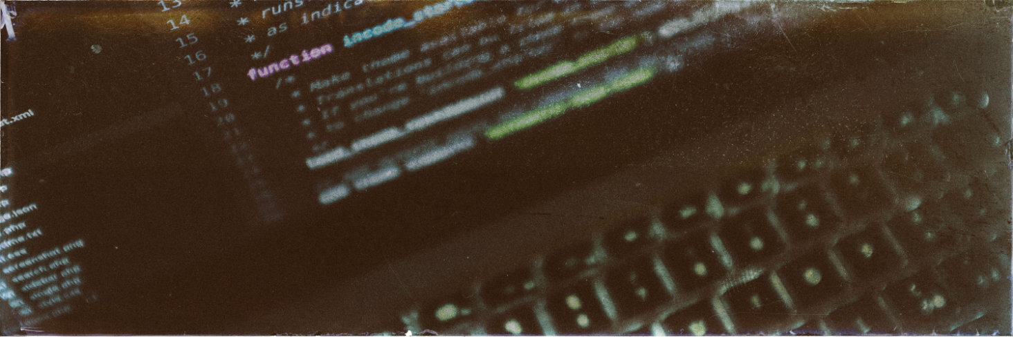 Featured Image: A close-up of a laptop with some code on the screen
