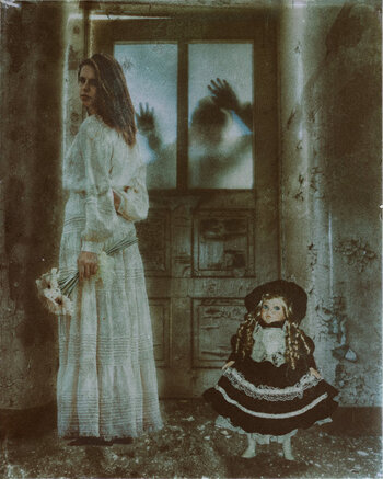 A woman and a doll in a vintage style