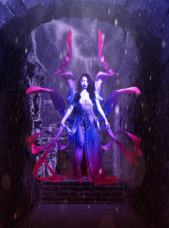 A raging storm as a beautiful woman, with wing-like ribbons around her, appears among stone ruins.